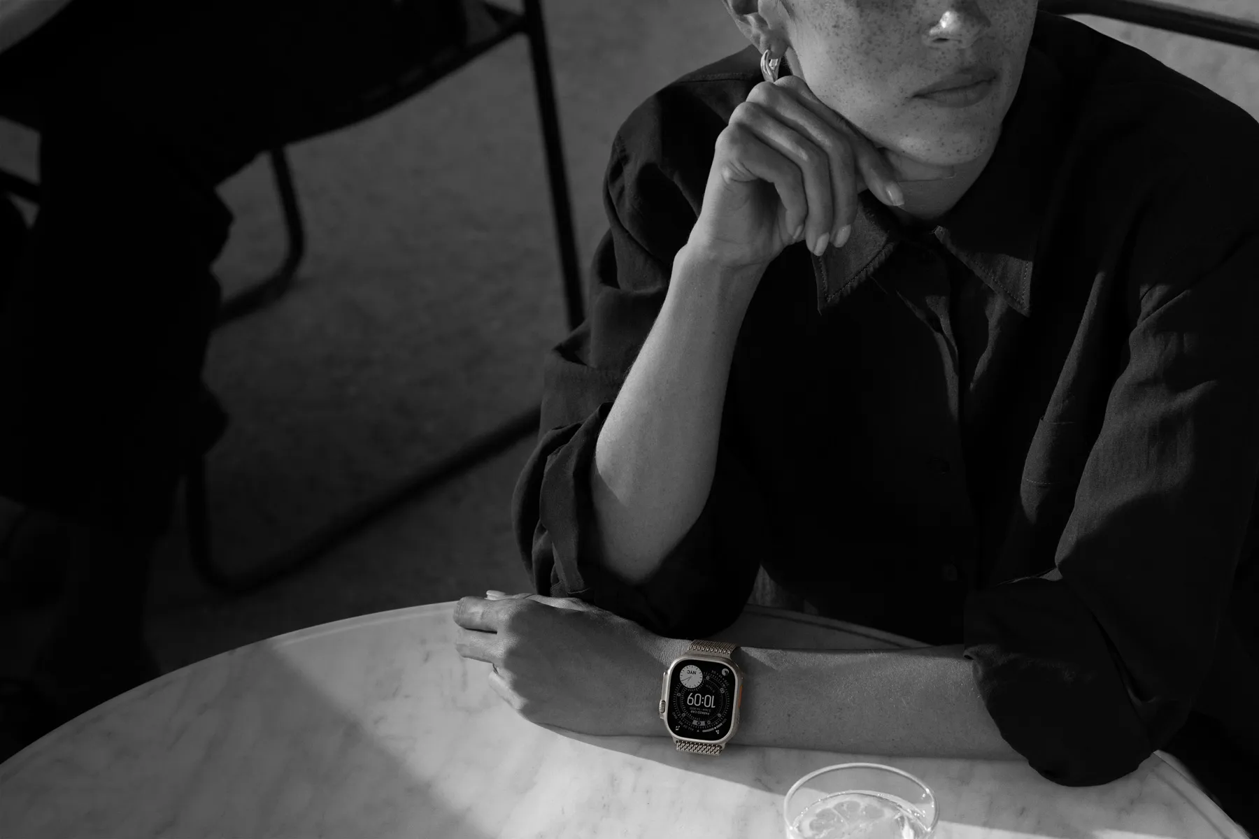 A person wears Apple Watch Ultra 3 while out to dinner
