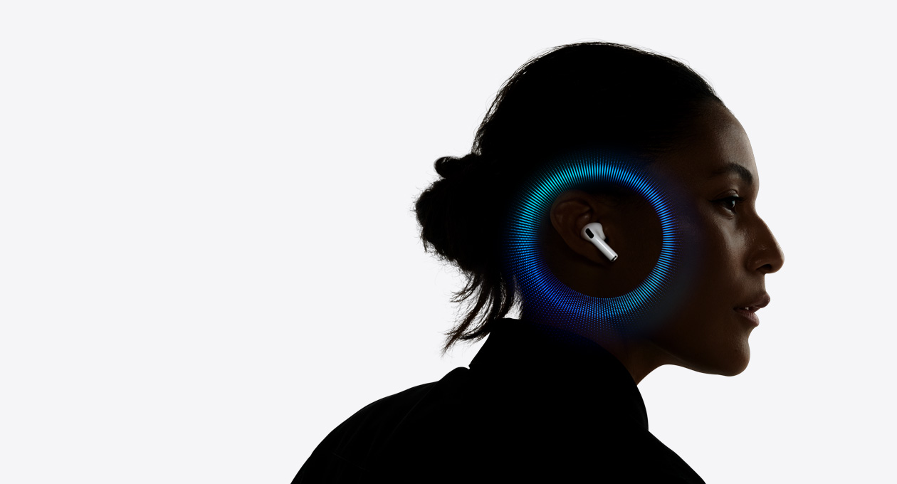 A person wearing AirPods Pro 3, pulsating waves around their ear