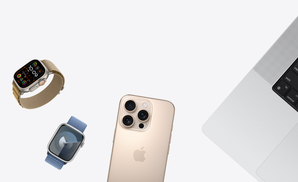 Nhiều sản phẩm khác nhau trong một dãy rải rác, bao gồm Apple Watch màu Tự Nhiên với Dây Quấn Alpine Màu Nâu Da Nhạt, Apple Watch màu Bạc với Dây Quấn Thể Thao Màu Hoa Hải Đằng, iPhone màu Titan Sa Mạc và MacBook màu Bạc